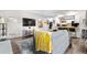 Comfortable living space with an open layout and stylish decor, seamlessly flowing into a well-equipped kitchen and bar area at 16001 E Alaska Pl # 12, Aurora, CO 80017