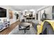 Inviting living room boasts an open floor plan and seamless flow to the kitchen, creating a comfortable and stylish living space at 16001 E Alaska Pl # 12, Aurora, CO 80017