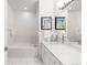 A bathroom with modern counters and fixtures, with an elegant bathtub at 2958 Syracuse St # 412, Denver, CO 80238