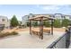 Inviting covered seating area in a well-maintained community with mature landscaping and walkways at 2958 Syracuse St # 412, Denver, CO 80238