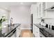 Well-lit kitchen featuring granite countertops, stainless steel appliances, and ample cabinet space at 2958 Syracuse St # 412, Denver, CO 80238