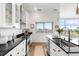 Bright kitchen with white cabinetry, sleek countertops, and modern stainless steel appliances at 2958 Syracuse St # 412, Denver, CO 80238