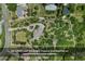 Expansive aerial view of the property, showcasing lush landscaping and a long driveway at 422 Suffolk Ln, Castle Rock, CO 80108