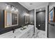Contemporary bathroom featuring dual sinks, modern fixtures, framed mirrors, and marble flooring at 422 Suffolk Ln, Castle Rock, CO 80108