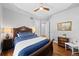 Cozy bedroom features a classic wooden bed frame, soft blue accents, and warm lighting for a restful retreat at 422 Suffolk Ln, Castle Rock, CO 80108