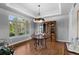 Elegant dining room featuring hardwood floors, a coffered ceiling, and scenic outdoor views at 422 Suffolk Ln, Castle Rock, CO 80108