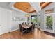 Elegant dining room featuring a wood ceiling, a modern chandelier, and abundant natural light at 422 Suffolk Ln, Castle Rock, CO 80108