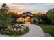 Stunning home featuring a well-manicured lawn, beautiful landscaping, and a charming water feature at 422 Suffolk Ln, Castle Rock, CO 80108