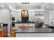 Bright kitchen featuring an island, modern appliances, and white cabinets, designed for culinary excellence at 422 Suffolk Ln, Castle Rock, CO 80108