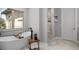 Serene bathroom features a freestanding tub, walk-in shower, and sleek fixtures, creating a spa-like retreat at 422 Suffolk Ln, Castle Rock, CO 80108