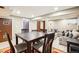 Versatile basement area with sofa, dining table, and access to storage space at 7925 W Layton Ave # 500, Littleton, CO 80123