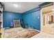 Basement featuring blue walls, neutral carpet, and storage space at 7925 W Layton Ave # 500, Littleton, CO 80123