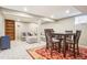 Finished basement with cozy seating area and dining table, perfect for entertaining at 7925 W Layton Ave # 500, Littleton, CO 80123