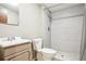 Bathroom featuring tiled walk-in shower and modern sink with vanity at 7925 W Layton Ave # 500, Littleton, CO 80123