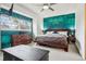 Primary bedroom with a stylish accent wall, a ceiling fan, and carpet at 7925 W Layton Ave # 500, Littleton, CO 80123