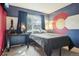 Charming bedroom featuring unique Colorado Flag design, a large window, and neutral carpet at 7925 W Layton Ave # 500, Littleton, CO 80123