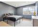 Modern bedroom with cool gray walls, a large window, and carpet at 7925 W Layton Ave # 500, Littleton, CO 80123