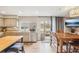 Bright eat-in kitchen with stainless steel appliances, granite countertops and sliding door to patio at 7925 W Layton Ave # 500, Littleton, CO 80123