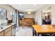 Eat-in kitchen and dining area featuring stainless steel appliances and light wood flooring at 7925 W Layton Ave # 500, Littleton, CO 80123