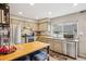 Spacious kitchen with stainless steel appliances, granite counters, and breakfast bar at 7925 W Layton Ave # 500, Littleton, CO 80123