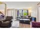 Inviting living room features large windows, comfortable seating and hardwood flooring at 7925 W Layton Ave # 500, Littleton, CO 80123