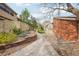 Well-maintained brick home featuring a charming walkway and low-maintenance landscaping at 7925 W Layton Ave # 500, Littleton, CO 80123
