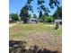 This property offers a large yard with scattered trees providing natural shade at 256 S 2Nd Ave, Brighton, CO 80601