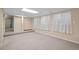 Spacious basement with neutral carpeting and ample storage at 8111 S Marion Ct, Centennial, CO 80122