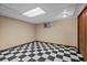 Clean, spacious basement with checkerboard floors at 8111 S Marion Ct, Centennial, CO 80122