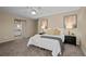 Bright bedroom with a queen-size bed and en-suite bathroom access at 8111 S Marion Ct, Centennial, CO 80122