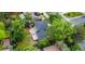 An aerial view of the rear of a home with mature trees and backyard at 9025 W 4Th Ave, Lakewood, CO 80226