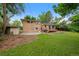 Backyard featuring a deck, shed and a large grass area at 9025 W 4Th Ave, Lakewood, CO 80226
