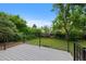Secluded backyard deck bordered by green foliage and an iron railing at 9025 W 4Th Ave, Lakewood, CO 80226
