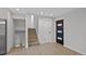 Spacious basement area featuring hardwood floors and access to stairs and doors at 9025 W 4Th Ave, Lakewood, CO 80226