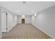 Finished basement with clean design and new flooring near stairs and recessed lighting at 9025 W 4Th Ave, Lakewood, CO 80226