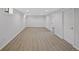 Spacious basement featuring new flooring, white walls and bright lighting at 9025 W 4Th Ave, Lakewood, CO 80226