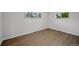 Bright bedroom with wood-look floors and natural light from two large windows at 9025 W 4Th Ave, Lakewood, CO 80226