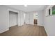 Light-filled bedroom with closet and doorway leading to a neutral-toned bathroom at 9025 W 4Th Ave, Lakewood, CO 80226