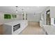 Open kitchen featuring a large center island with modern appliances and a spacious living area at 9025 W 4Th Ave, Lakewood, CO 80226