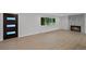 Bright living room featuring hardwood floors, a tiled fireplace, and a large window with neighborhood views at 9025 W 4Th Ave, Lakewood, CO 80226