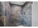 Shower featuring stylish stone-like tile at 9025 W 4Th Ave, Lakewood, CO 80226