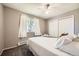 Relaxing bedroom featuring bright window, neutral walls, and closet at 2208 Emery St, Longmont, CO 80501