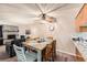 Open floorplan of the dining area with views to the fireplace and kitchen at 2208 Emery St, Longmont, CO 80501