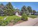 Charming home featuring a well-maintained lawn, mature trees, and inviting curb appeal at 2208 Emery St, Longmont, CO 80501