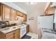 Efficient kitchen with white appliances, stone countertops, and modern flooring at 2208 Emery St, Longmont, CO 80501