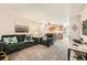 Inviting living room open to kitchen featuring a cozy sofa and neutral tones at 2208 Emery St, Longmont, CO 80501