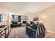 Comfortable living room features a brick fireplace, plush seating, and natural light at 2208 Emery St, Longmont, CO 80501