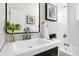 Bathroom featuring a dark vanity, subway tile surround in the shower and greenery at 7891 Maria St, Westminster, CO 80030