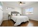 Bright bedroom with hardwood floors, ceiling fan, and natural light from two windows at 7891 Maria St, Westminster, CO 80030