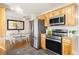 Modern kitchen features stainless steel appliances and a view into the dining room at 7891 Maria St, Westminster, CO 80030